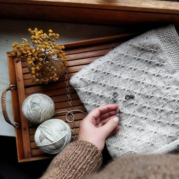 Knit this lovely Lisbeth blanket pattern by Anja Heumann! It&rsquo;s so soothing to the eyes and features a mesmerizing geometric texture made with a simple cross stitch, adding a touch of modern sophistication to your blanket. It&rsquo;s an intermediate project for knitters looking to embark on a relaxing yet rewarding knit project, and you also get to learn how to create a moss stitch edge with the step-by-step instructions in the downloadable PDF. It comes in one size, but it&rsquo;s totally customizable, as you can easily adjust the width and length of the blanket to your desire!