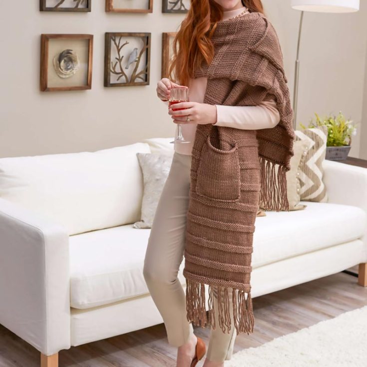 Isn&rsquo;t this stunning piece so elegant and posh? This chic and functional scarf blends the warmth of a super scarf with the convenience of deep pockets, perfect for keeping your hands toasty or stashing your essentials. This easy project uses bulky yarn with a thick yarn weight for a faster knitting project, and it will be so cozy to snuggle in! Try it now!