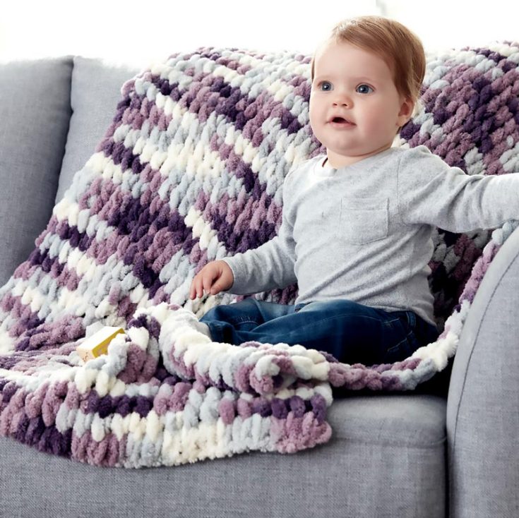 Here&rsquo;s another design that you can try knitting for your tiniest tots! Made with soft, super bulky yarn from Bernat Alize Blanket-EZ, this beginner-friendly project uses pre-looped yarn, eliminating the need for traditional needles making it ideal for stress-free finger knitting. The pattern results in a plush, fluffy blanket that&rsquo;s gentle on delicate skin and will become a treasured family keepsake. The finished size is 99cm.