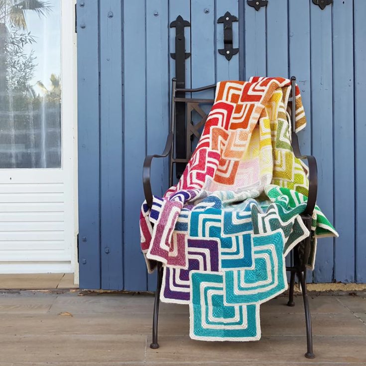 If you want a vibrant blanket to add a pop of color to your living quarters, then try out this Sliding Tiles Blanket! It features a unique piecing method, which involves making several block motifs of different colors and joining them together to create this fantastic quilt-like effect. It&rsquo;s a little challenging for beginners as it&rsquo;s catered more towards advanced intermediate and experienced knitters, and the finished size is 132cm x 132cm.
