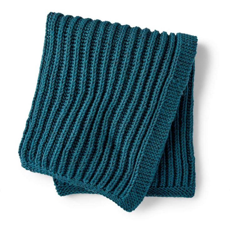 Learn to knit this simple yet gorgeous Squishy Fisherman&rsquo;s Rib blanket! This cozy masterpiece features a plush, textured design and is ideal for chilly evenings. It&rsquo;s also a beginner pattern, and it&rsquo;s easy to knit this huggable blanket! If you&rsquo;re a visual learner, this pattern is right up your alley, as it comes with both written and video tutorials to guide you through and through. The finished size is approximately 38&rdquo; x 48&rdquo;.