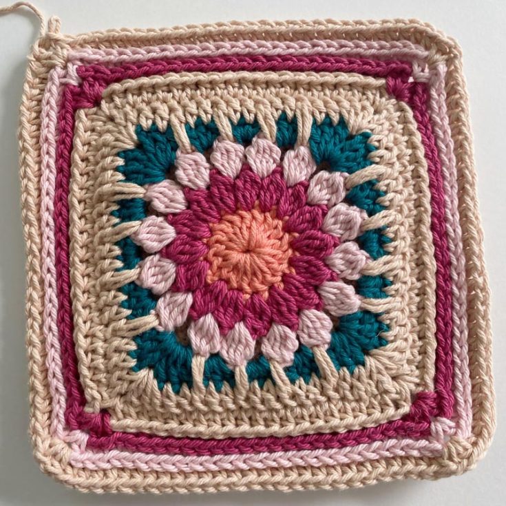 Here's another beautiful and well-made granny square potholder! This lovely design features a gorgeous sunburst center with camel stitch borders and a pattern catered to advanced beginners. Learn how to crochet this stunning 7.75" x 7.75" design here.