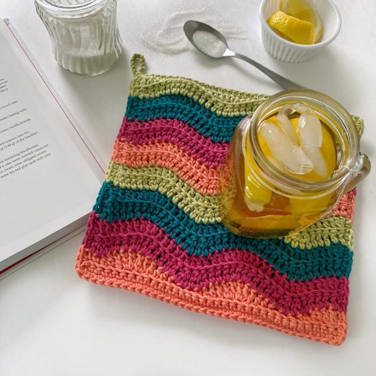 Finally, we have this stunning and colorful potholder design on the list! This advanced beginner pattern allows you to mix and match your favorite colors to create a lovely wavy and ripple-like potholder. Here's a tip! Create your potholder according to the season's colors for seasonal decor. The final measurements are 9" wide x 8.75" long.