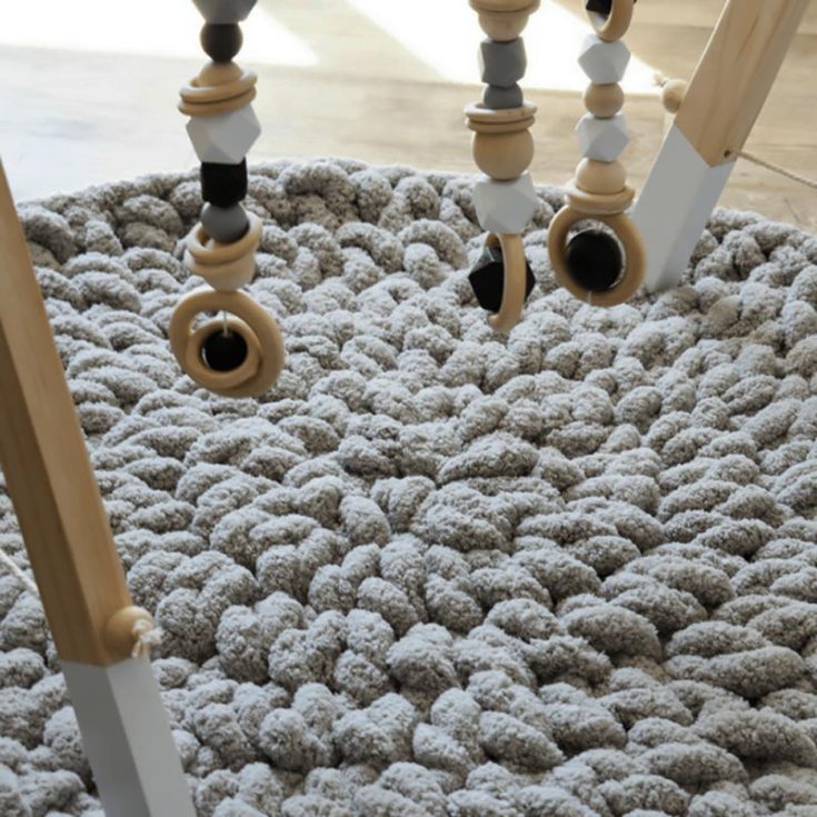 Need a soft, safe surface for your baby to play or lie in? Make this modern plush crochet baby play mat that can be done in an hour! It's super easy and straightforward.