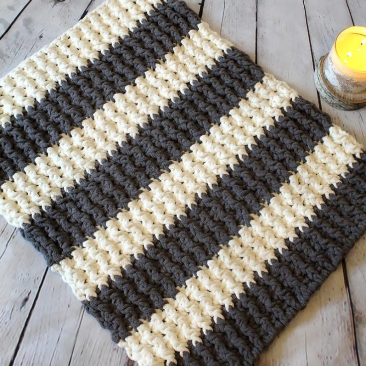 This plush ribbed mat was created to have a bath mat that is soft and squishy enough to be comfy but not hard and stiff enough that it could not drape over a tub. Sounds like something you've been looking for? Grab your hooks and yarn and make this today!