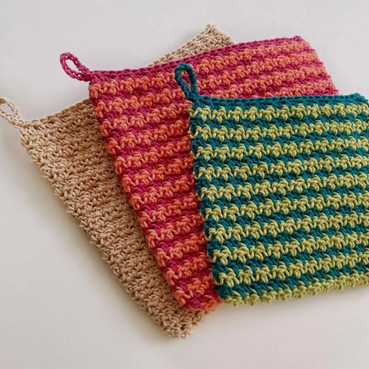 This Houndstooth Stitch Potholder pattern uses contrasting colors to get the prettiest results. This advanced beginner's pattern is crocheted in the round and then seamed together at the top to create a double-thick potholder design. The finished size is approximately 9" wide x 8.75" long.