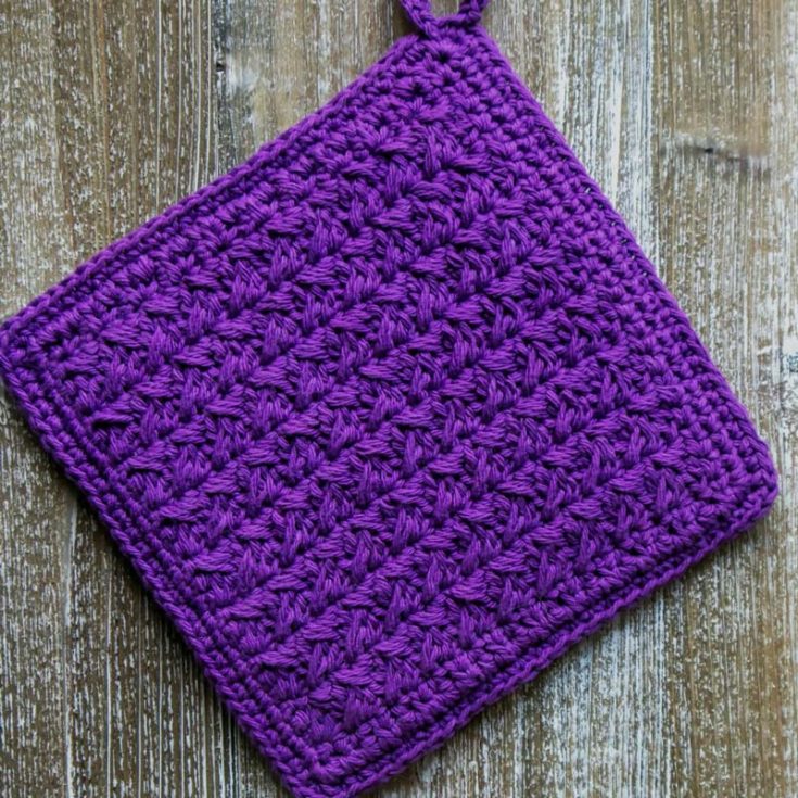 Learn how to make this modern crochet potholder pattern that uses basic stitches. This Spiked Potholder comes with in-depth written instructions and a video tutorial that is easy to follow; hence, beginners should give it a go! It's a relatively simple design; the finished size is 8" x 8".