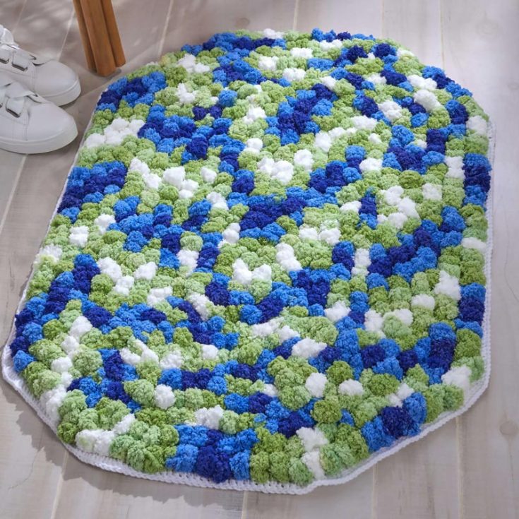 Are you in love with this non-slip pompom crochet rug? You'll be surprised to know it's an easy, soft, squishy, and fun pattern!
