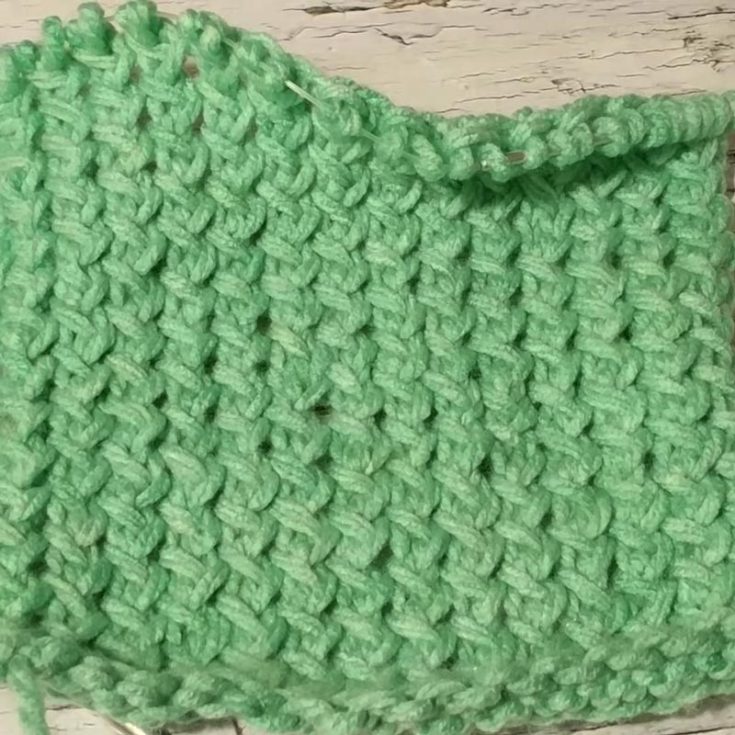 The Caterpillar Stitch, or the Vertical Dash, is a 12-row repeat pattern that adds lovely textures to your fabric. It looks pretty similar to the Long Raindrops Stitch, but it has the Reverse Stockinette background with alternating vertical stripes.