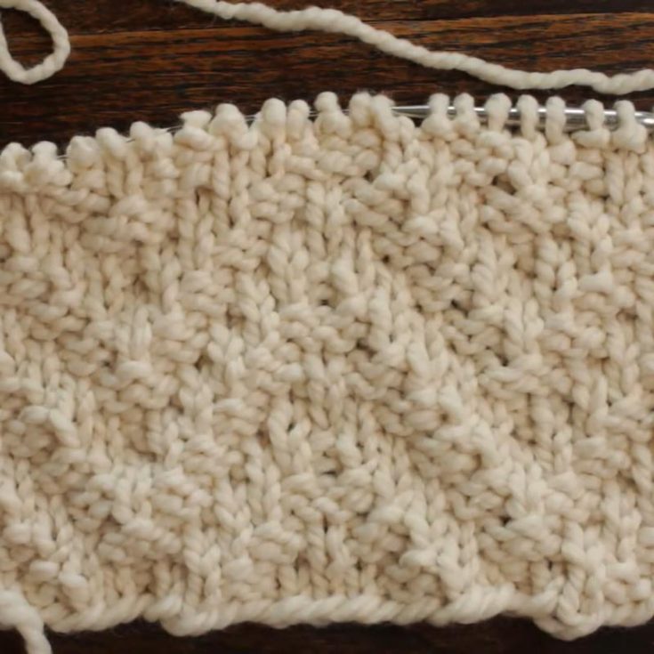 The Chevron Rib Stitch is one of the many favorite stitches knitters use. This is because it lays flat, and the pattern is reversible. It creates a lovely thick zigzag texture on the fabric and an 8-row repeat design.