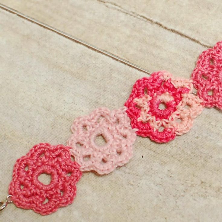 Make this sweet, girly girl flower cuff by crocheting flower motifs together to create a lovely, thick bracelet cuff! It's a simple design that allows you to add or remove motifs to increase or decrease the size.
