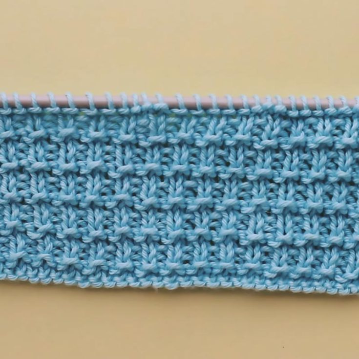The Hurdle Stitch is a beginner pattern that is great for those looking to expand beyond the Garter and Stockinette stitch. It&rsquo;s a 4-row repeat that lays flat and is reversible. Not to mention, it creates a very stretchy fabric, too.