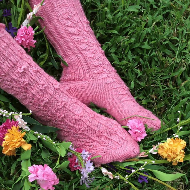 Have a look at this gorgeous and feminine pattern! It features a delicate floral design along the front of the socks, and it is worked from the toes up with a short-row heel technique. It's a pattern fit for confident beginners, and all you need are 2.5mm of circular or double-pointed needles.&nbsp;
