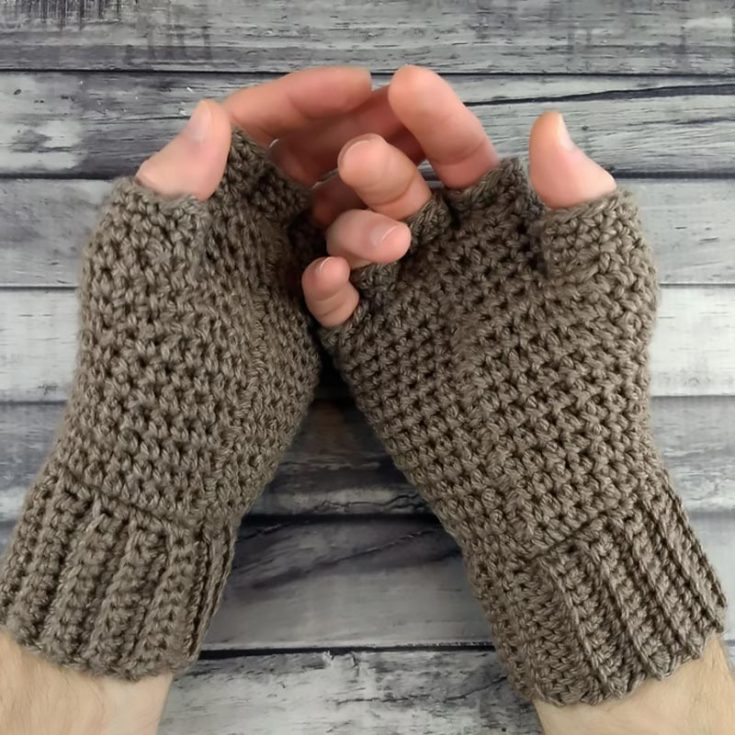 This fingerless glove has holes for all five fingers, making it seem more macho so that it can be used by both her and him! It works from the bottom up and is a relatively straightforward design.