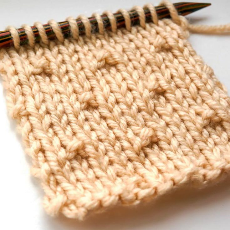 The Simple Seed Stitch is a variant of the classic Seed Stitch. The only difference is that the seeds on the fabric are more spread out for a minimalistic and modern aesthetic. It&rsquo;s an 8-row repeat design with a Stockinette stitch background with alternating rows of raised purl seed stitches.