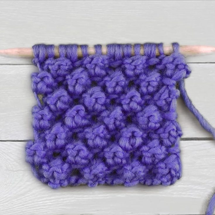 Also known as the Raspberry or Blackberry Stitch, the Trinity Stitch is a 4-row repeat pattern. It creates adorable bobble textures on the fabric and replicates a berry-like effect. It&rsquo;s an intermediate project, and you&rsquo;ll increase and decrease to raise the texture.