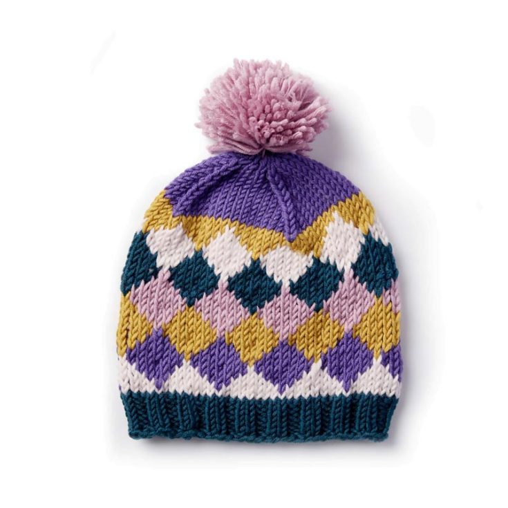 This beanie design is one of our personal favorites among the entire list of patterns. It features gorgeous diamond shapes, and it&rsquo;s knit in the round, making it an intermediate-level knit project. It is also a one-size-fits-all.