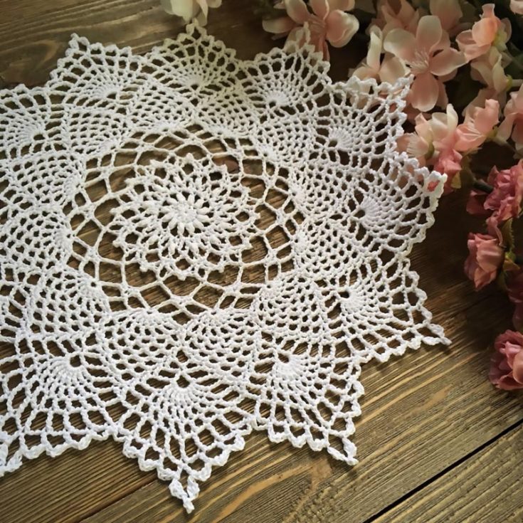 This soft and delicate doily still leaves much character to be admired! This 11" in diameter pattern features special stitches like the puff stitch, picot, and cluster stitch.
