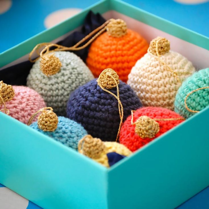 Nothing can get more symbolic than a classic Christmas bauble-decorated tree. These easy baubles are made with 4-ply yarn, but use any weight yarn to vary the scale and texture of your ornaments.