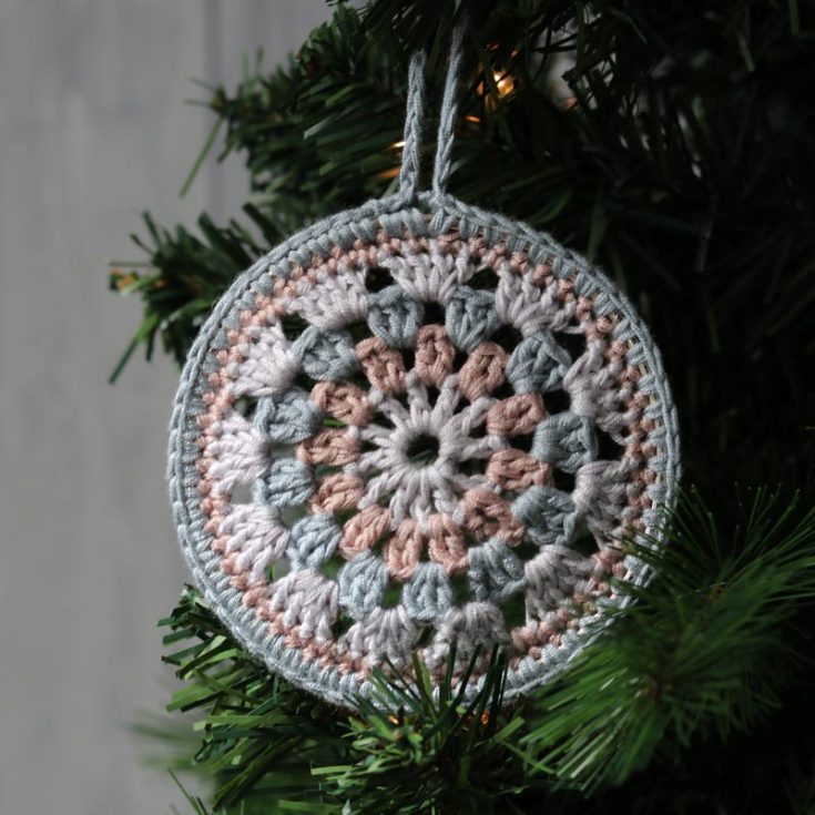 Use a granny circle to make this lovely ornament. It starts with crocheting a granny circle; then, a metal ring is attached to the final round. Super easy!