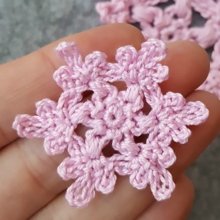 Want a floral themed Christmas? Make this dainty floral crocheted snowflake to adorn your tree or as gift tags.