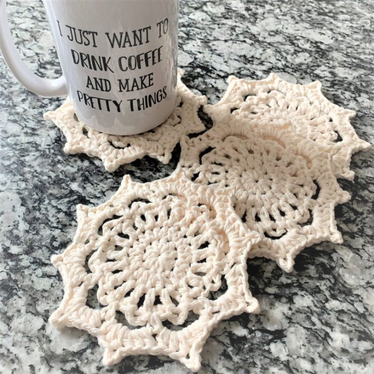 This snowflake starts with a magic circle and then works up in the round with easy crochet stitches. It's shape allows it to be a very fine coaster as well!