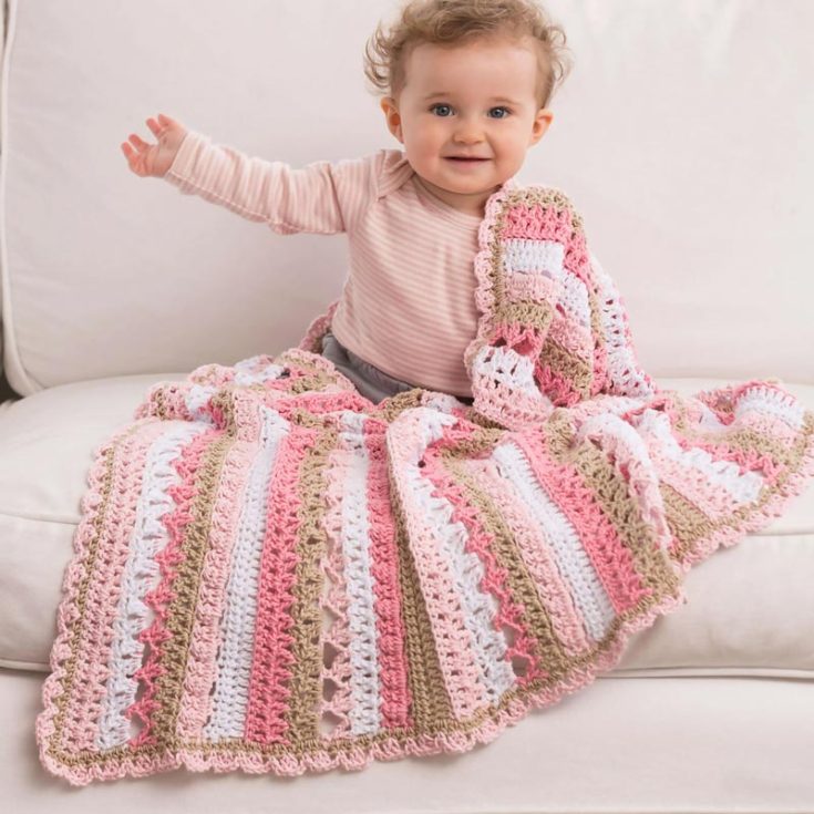 Take up this beginner-friendly baby blanket that's filled with feminine lace-like textures that will keep your baby as snug as a bug in a rug!