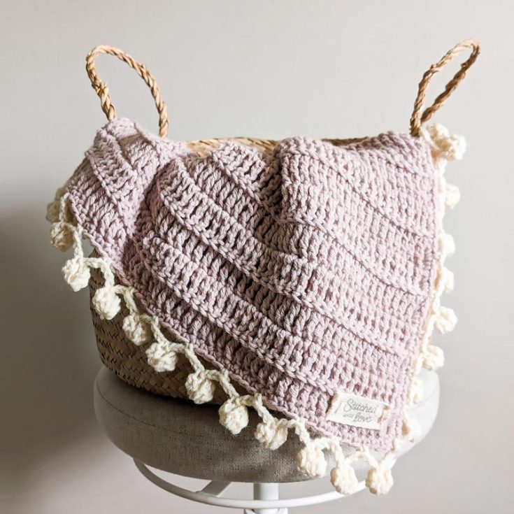 The blossom baby blanket may be just what you need to keep your baby warm this chilly season. It's easy enough to make by using basic stitches and can be easily customized.