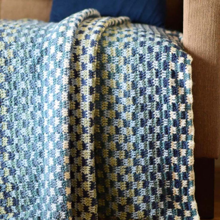 This checker crochet stitch requires some patience, but it's going to be so worth it! It's named River Run because of the pretty blues and greens that make it seem like an endless stream running. It's 36&rdquo; X 42&rdquo; inches in size.
