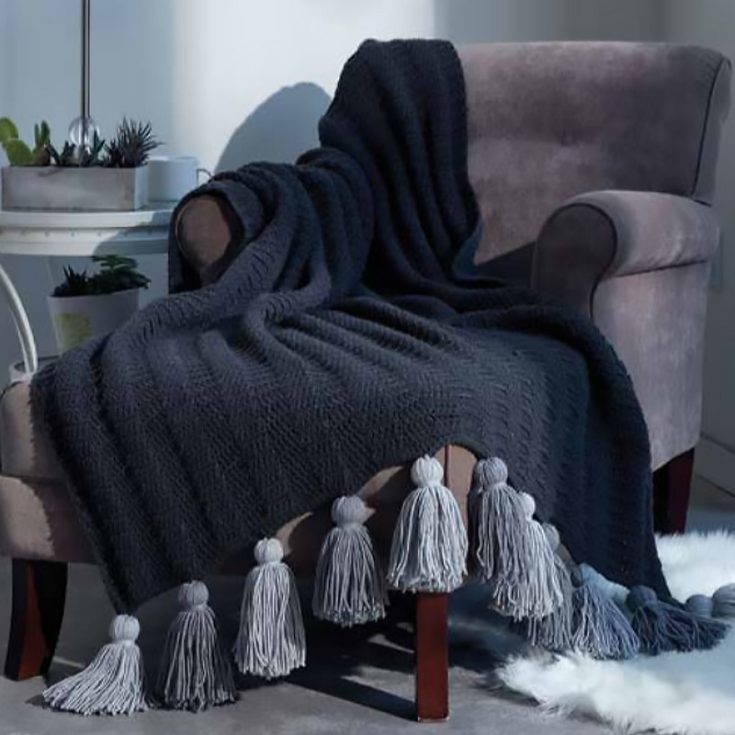 Crochet your way to cozy luxury with this elegant tasseled throw! Perfect for draping over your couch or bed, it&rsquo;s a beginner-friendly pattern that&rsquo;s both stylish and snug for those chilly days.