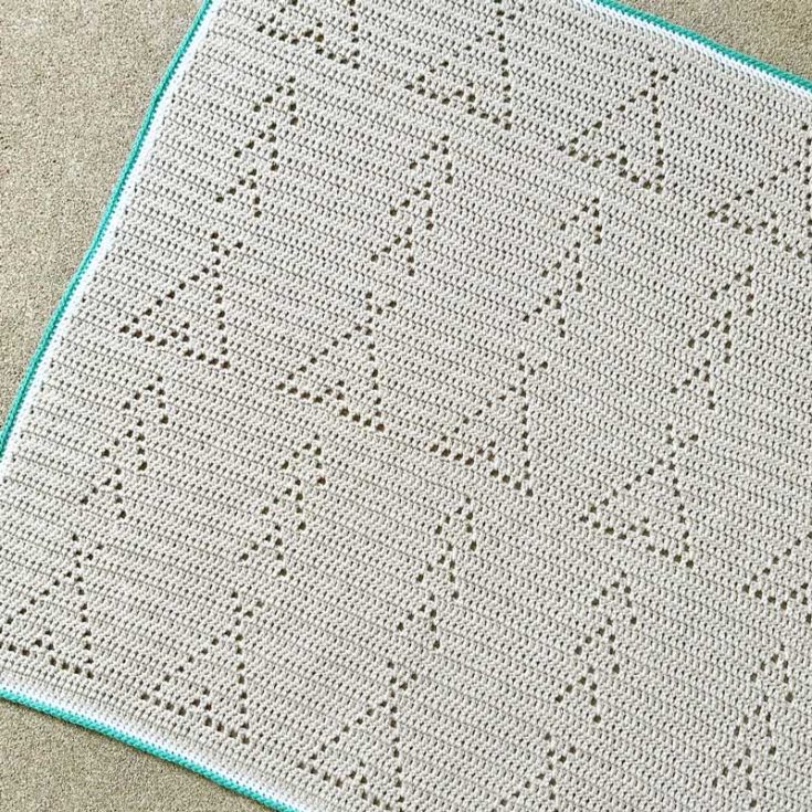This crocheted blanket features an adorable teepee and arrow filet crochet pattern, adding a rustic touch wherever you place it. With its minimalist design, it&rsquo;s an easy and charming project to work up.